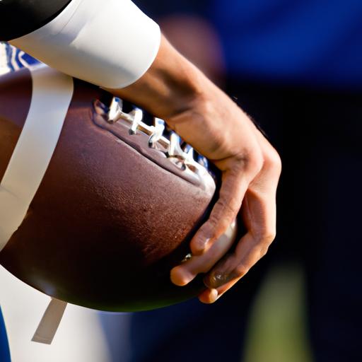 A player gripping the football tightly, ready to make a game-changing play.